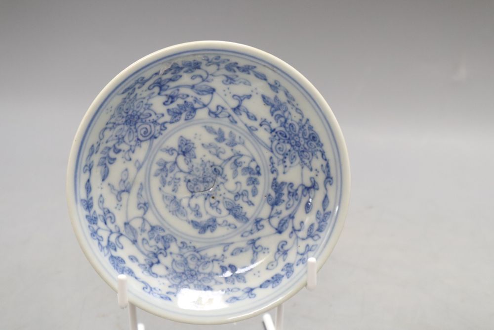 A Chinese blue and white vase and a dish bearing a Qianlong mark, diameter 11.5cm